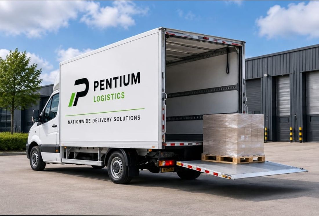 Pentium Logistics box van with the tail lift lowered and a pallet on it